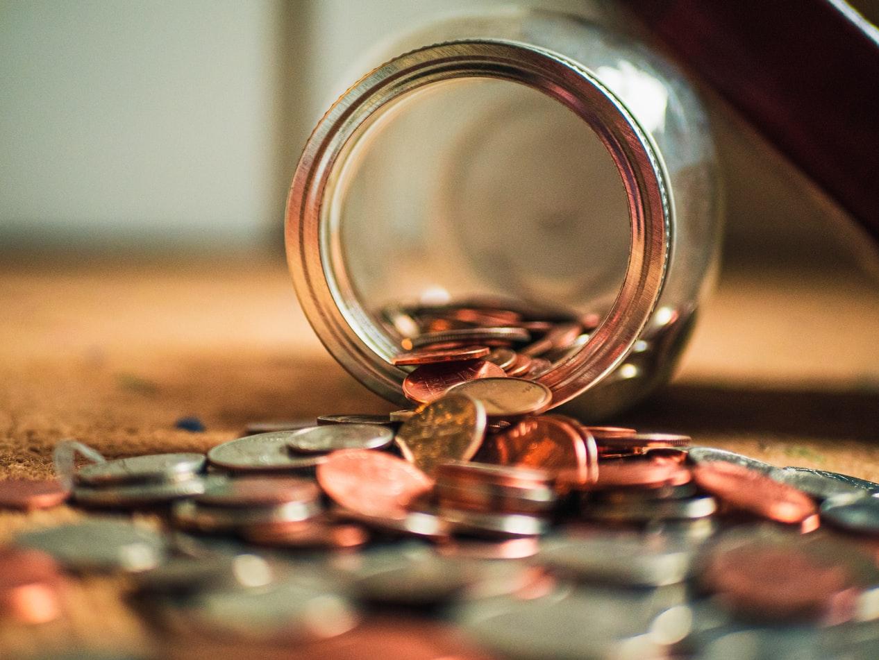 Coins spilling from a jar